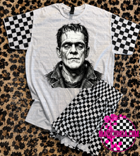 Load image into Gallery viewer, Horror collection graphic tee with checkered print sleeve
