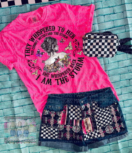 They whispered to her you cannot withstand the storm SHE WHISPERED BACK I AM THE STORM on neon pink COMFORT COLORS GRAPHIC TEE // denim patched up shorts available separately - Mavictoria Designs Hot Press Express