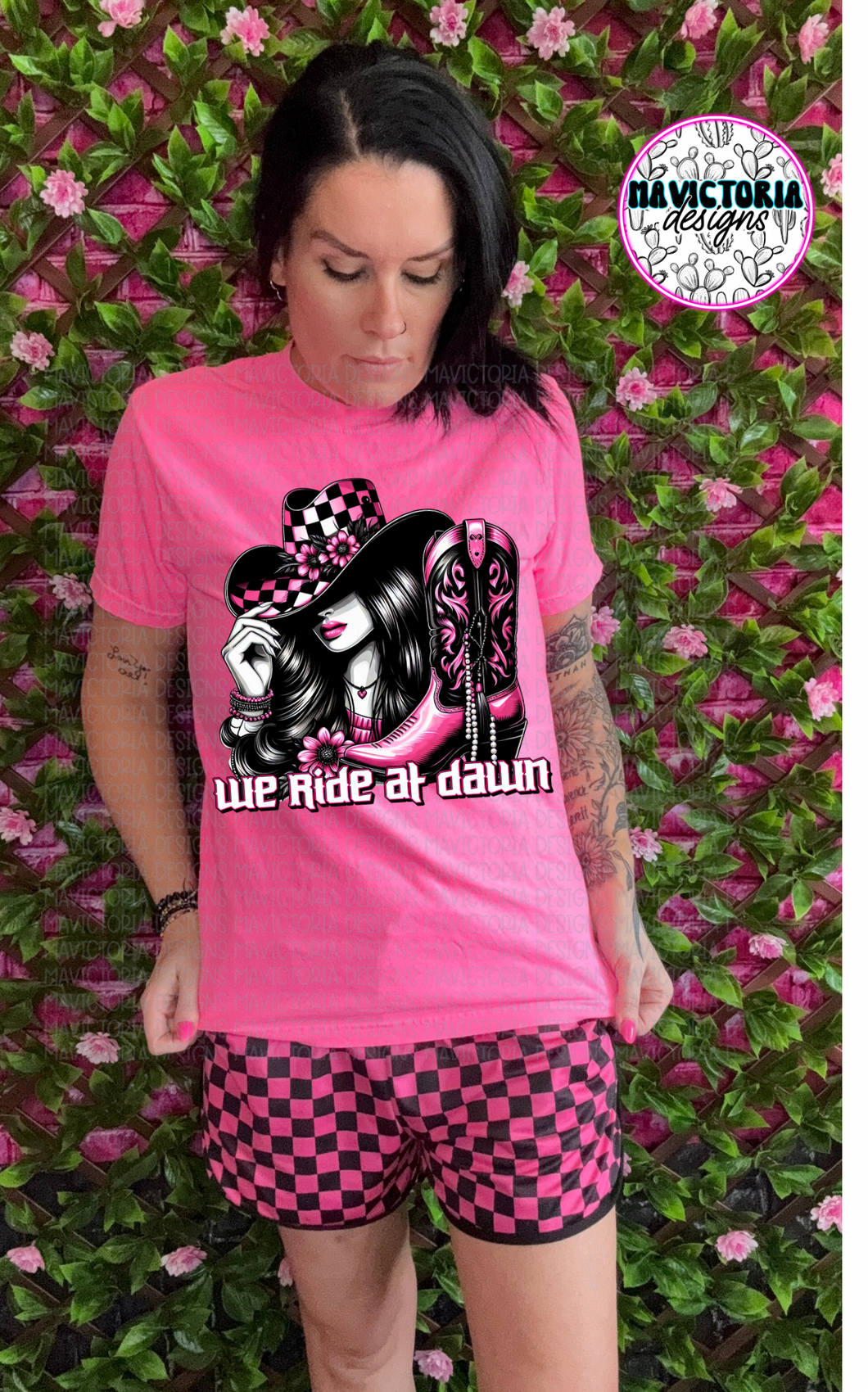 We ride at dawn western cowgirl checkered print on NEON PINK graphic tee