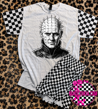 Load image into Gallery viewer, Horror collection graphic tee with checkered print sleeve
