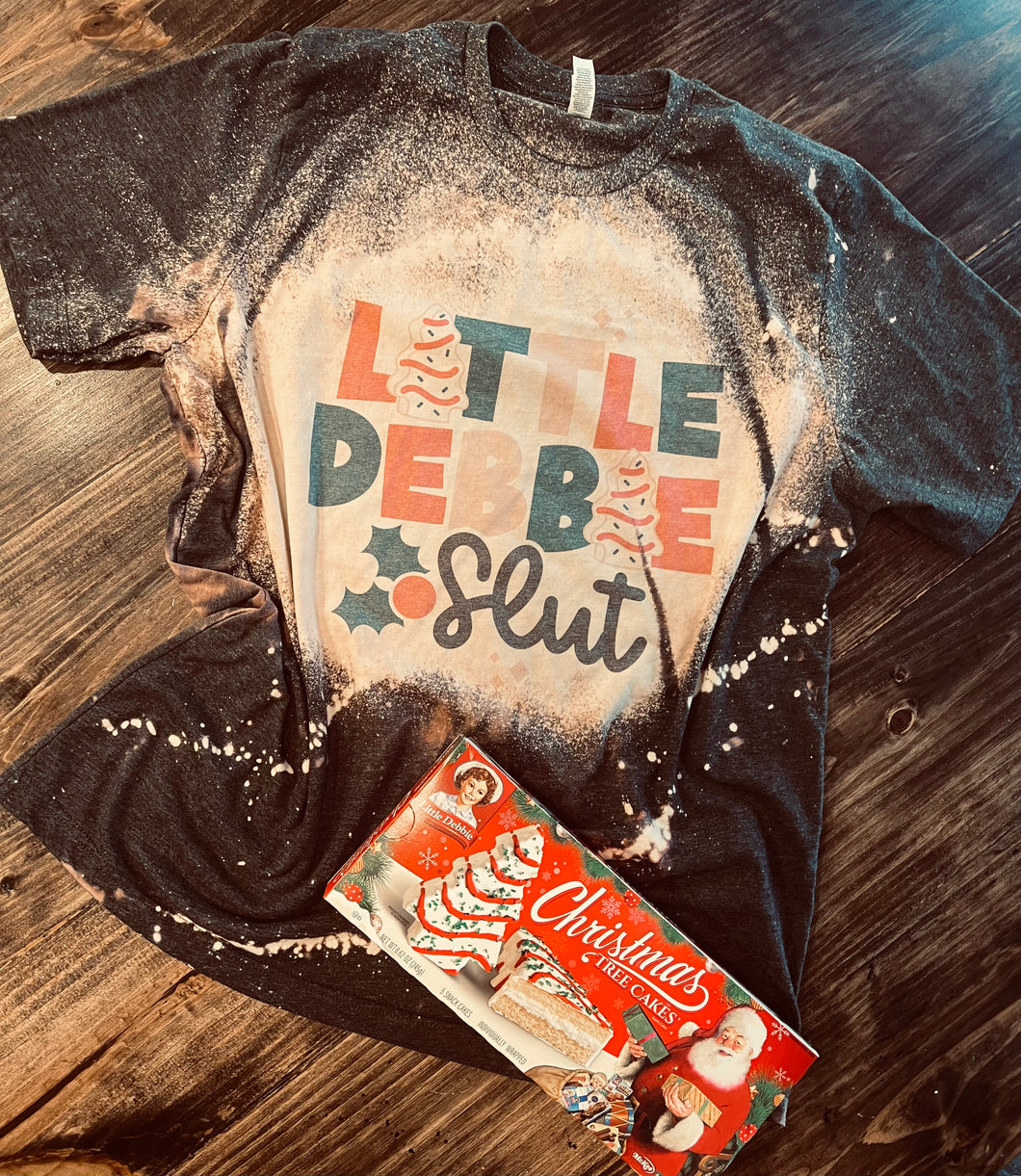 Little Debbie slut Christmas Bleached charcoal graphic tee, sweatshirt, long sleeve OR hoodie - Mavictoria Designs Hot Press Express