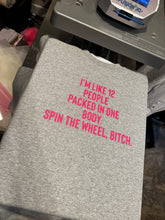 Load image into Gallery viewer, I’m like 12 people packed in one body. Spin the wheel bitch. on grey WITH HOT PINK LETTERS hoodie, crewneck, long sleeve or graphic tee - Mavictoria Designs Hot Press Express
