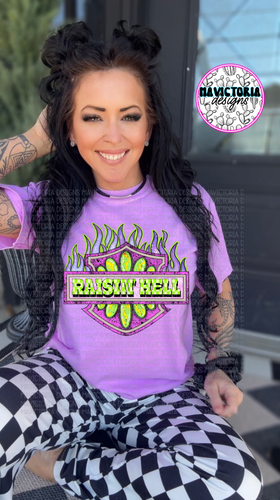 Raisin’ Hell graphic tee on neon violet comfort colors tee - Mavictoria Designs Hot Press Express