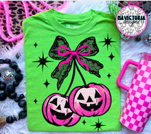 Load image into Gallery viewer, Neon pink coquette jack o lantern pumpkin cherries comfort colors graphic tee (you pick color) - Mavictoria Designs Hot Press Express
