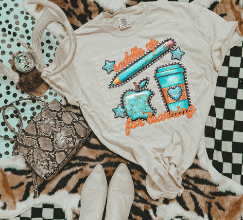 Saddle up for learning on sand gildan graphic tee - Mavictoria Designs Hot Press Express