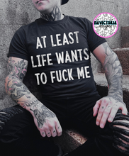 Load image into Gallery viewer, At least life wants to fuck me on black hoodie , crewneck, long sleeve or tee - Mavictoria Designs Hot Press Express
