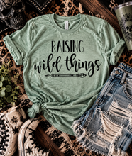 Load image into Gallery viewer, Raising wild things custom graphic bella canvas tshirt. Unisex triblend green. Momlife. Mama. Mom. Motherhood. - Mavictoria Designs Hot Press Express
