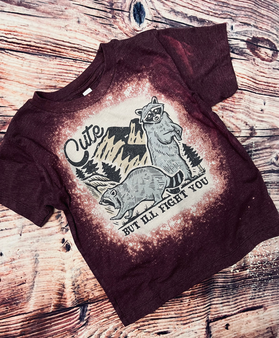Cute but I’ll fight you. Raccoons graphic heather maroon bleached tee. - Mavictoria Designs Hot Press Express
