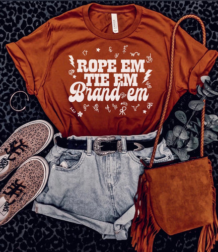 Rope em tie em brand em western women’s graphic tee - Mavictoria Designs Hot Press Express