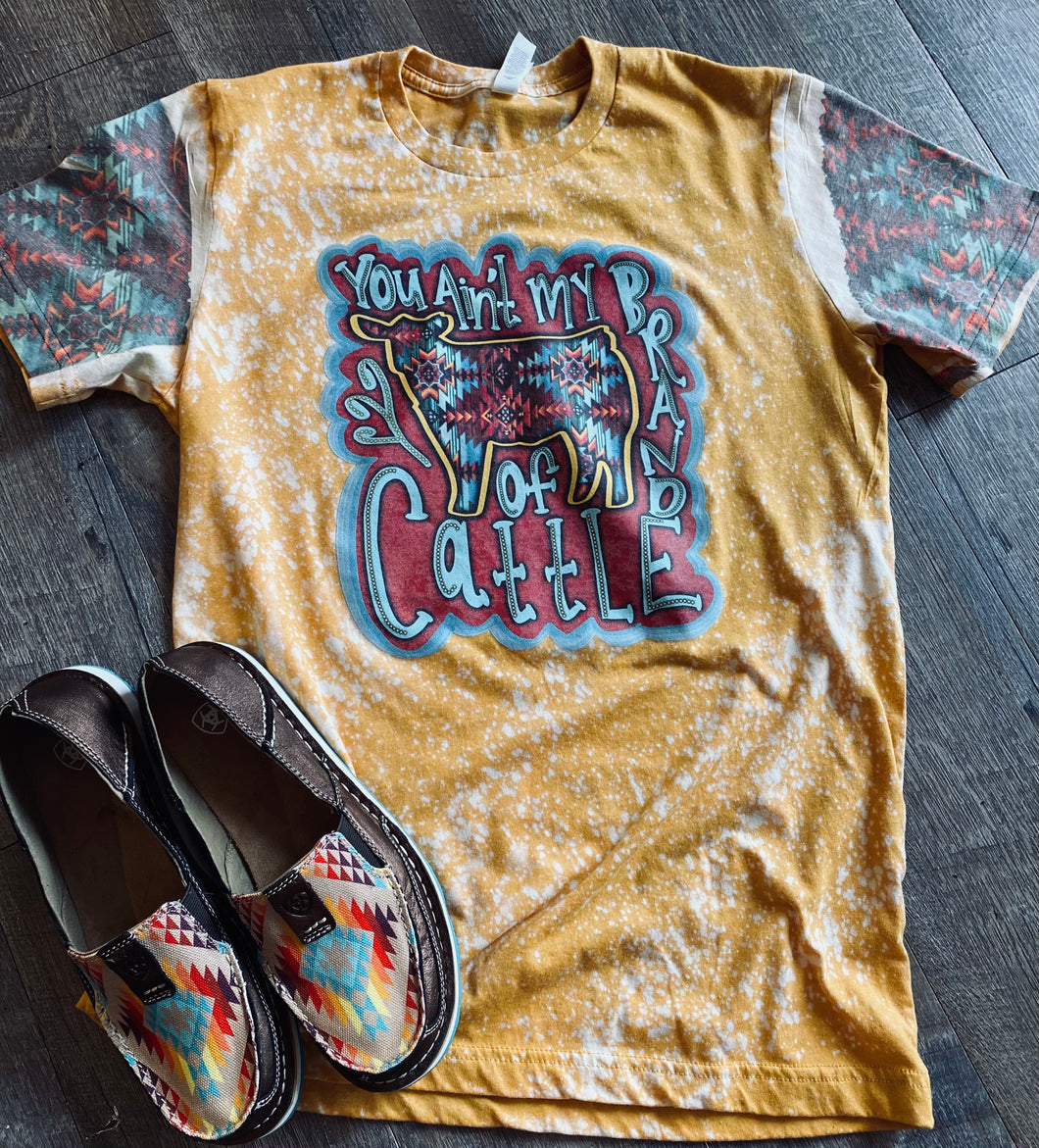 You ain’t my brand of cattle with Aztec sleeves mustard bleached graphic tee - Mavictoria Designs Hot Press Express